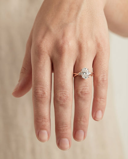 Dusty Select Hidden Halo Solitaire Oval Lab Diamond Engagement Ring in 14K Rose Gold, shown on hand | RockHer