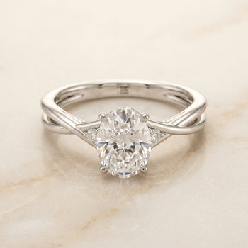 The Dusty Hidden Halo Solitaire Oval Engagement Ring Setting in 18K White Gold