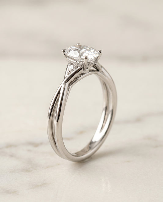 Twisted Shank Hidden Halo Solitaire Oval in 18K White Gold
