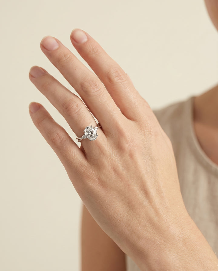 The Dusty Solitaire Engagement Ring Setting for Oval Diamonds in 18K White Gold