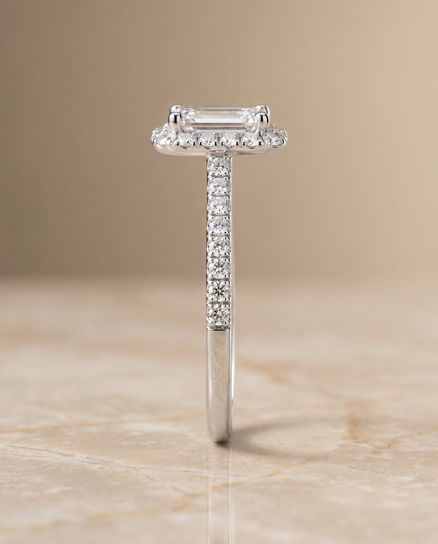 Dylan Select Petite French Pavé Halo Emerald Cut Lab Diamond Engagement Ring in Platinum, side view | RockHer