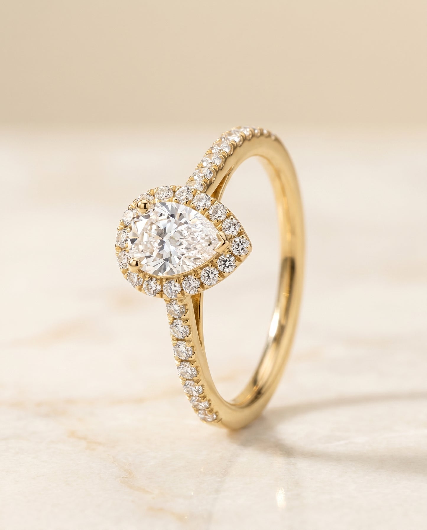 The Dylan Pavé Halo Engagement Ring Setting for Pear Diamonds in 18K Yellow Gold