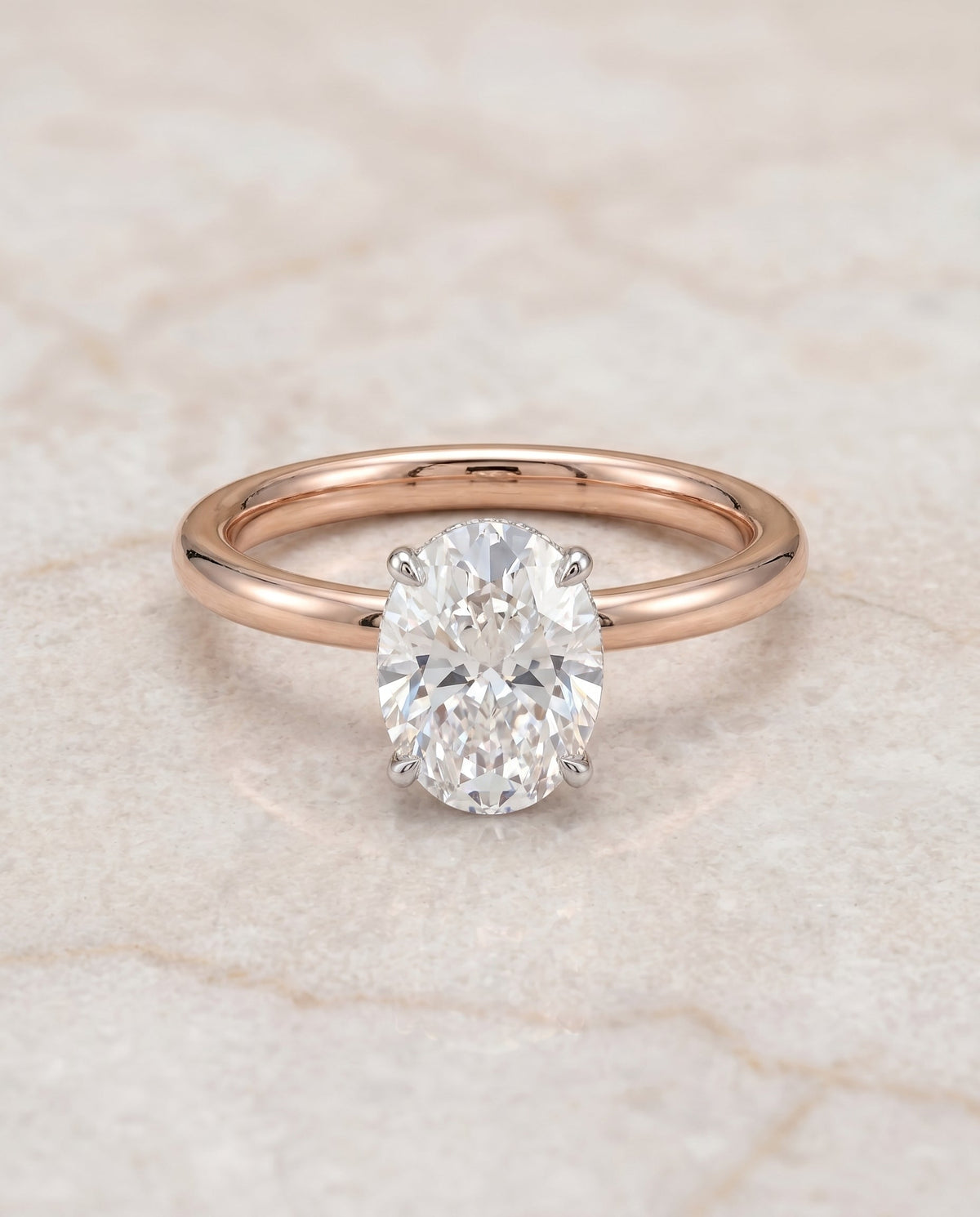 Eartha Select Upper Hidden Halo Solitaire Oval Lab Diamond Engagement Ring in 14K Rose Gold, shown on hand, angled | RockHer