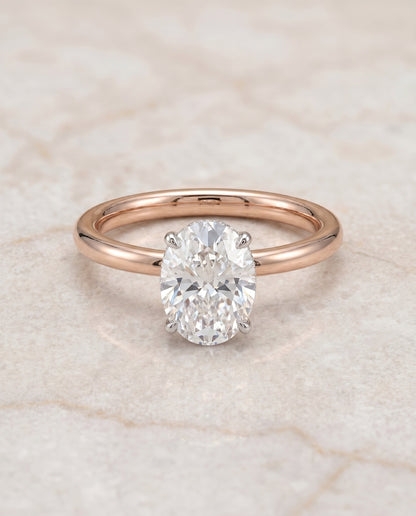 Eartha Select Upper Hidden Halo Solitaire Oval Lab Diamond Engagement Ring in 14K Rose Gold, shown on hand, angled | RockHer