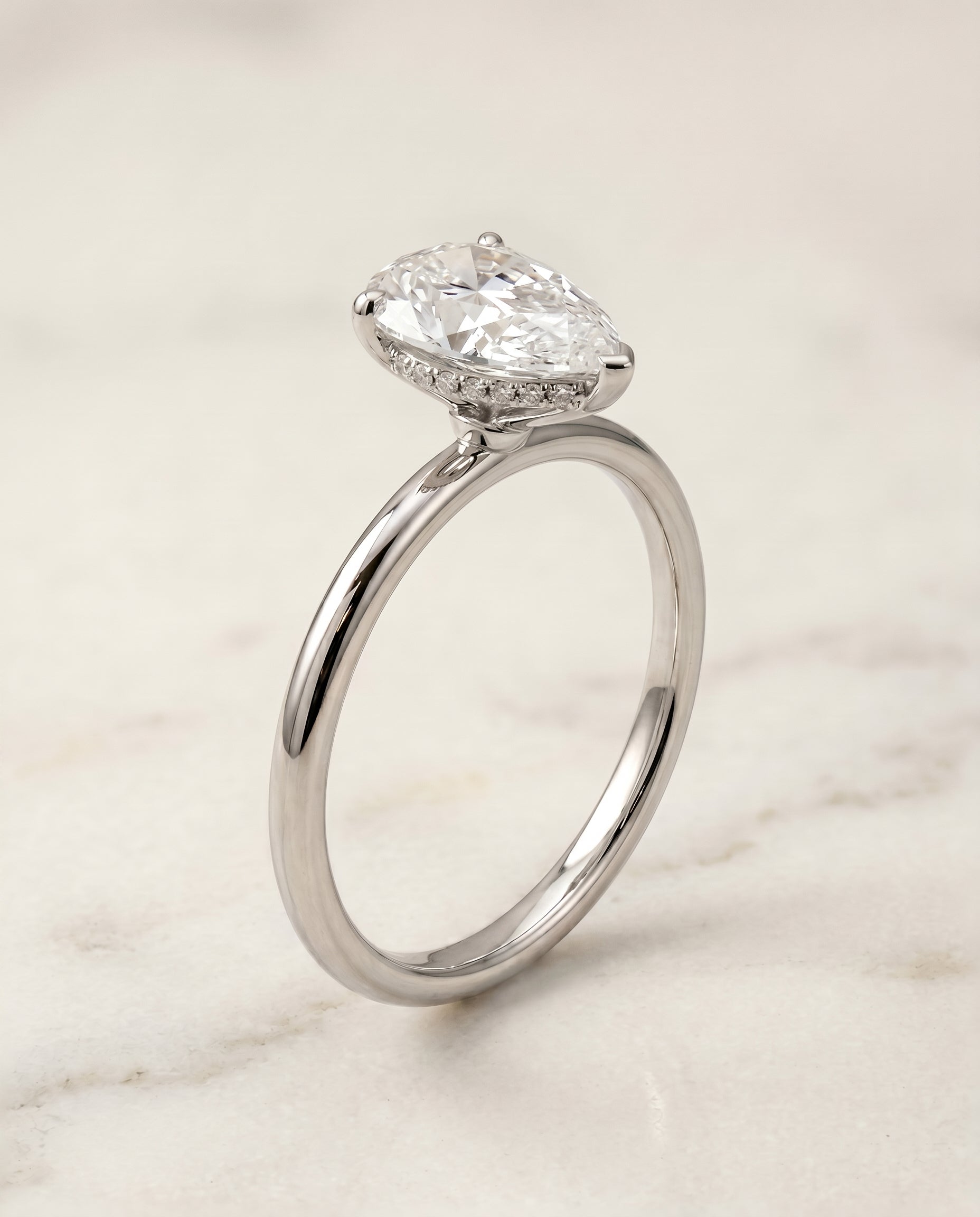 Upper Hidden Halo Solitaire styling on The Eartha princess engagement ring setting | RockHer