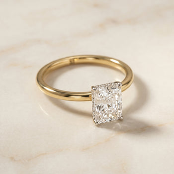 The Eartha Hidden Halo Engagement Ring Setting for Radiant Diamonds in 18K Yellow Gold