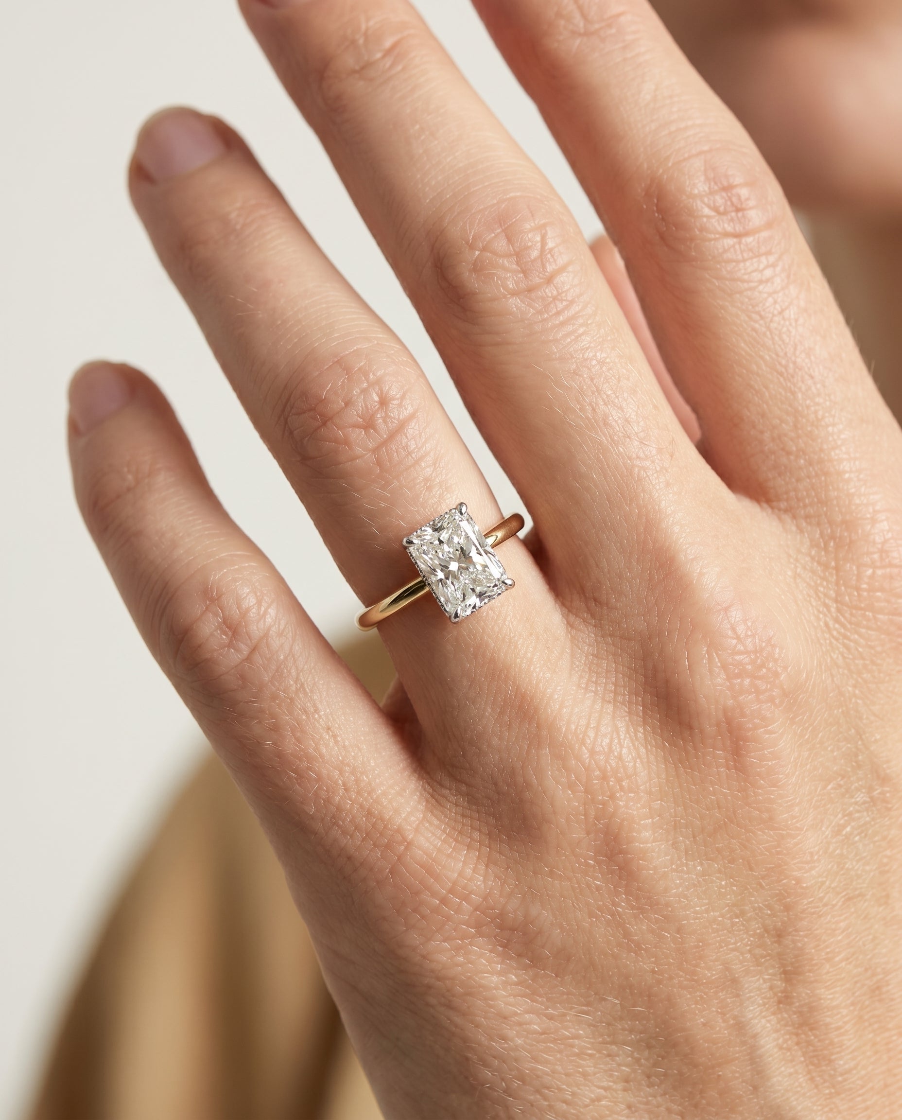 The Eartha engagement ring setting in 18K Yellow Gold, upper hidden halo solitaire cut design | RockHer
