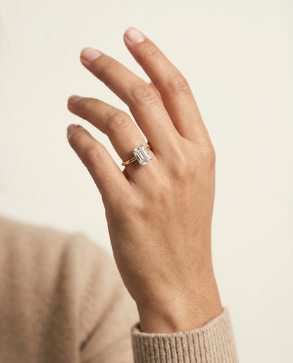 The Eartha Upper Hidden Halo Solitaire Emerald Cut Engagement Ring Setting in 18K Yellow Gold