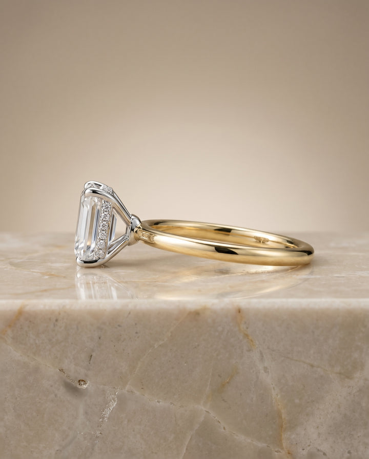The Eartha Upper Hidden Halo Solitaire Emerald Cut Engagement Ring Setting in 18K Yellow Gold