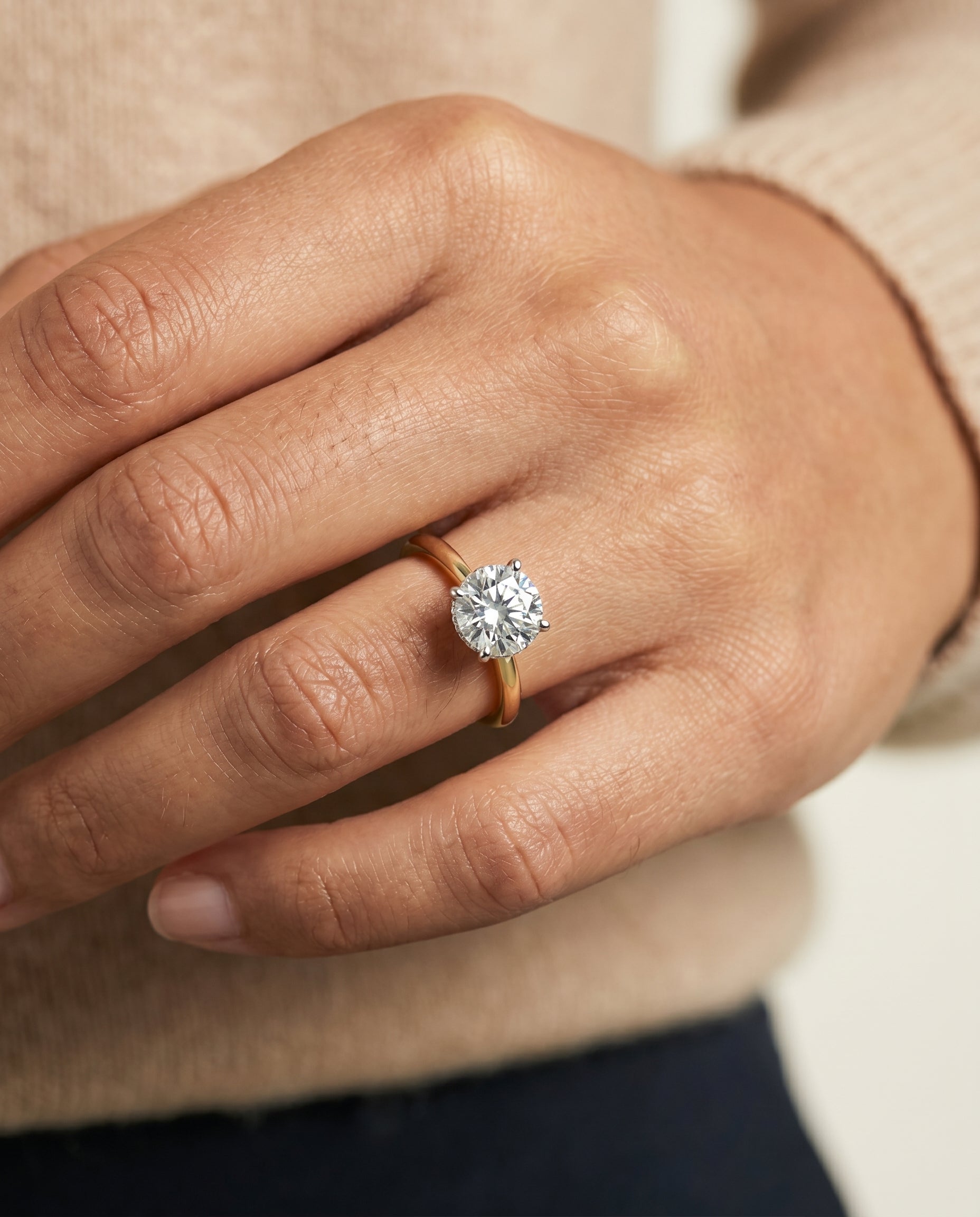 Eartha Select Upper Hidden Halo Solitaire Round Lab Diamond Engagement Ring in 18K Yellow Gold, shown on hand | RockHer