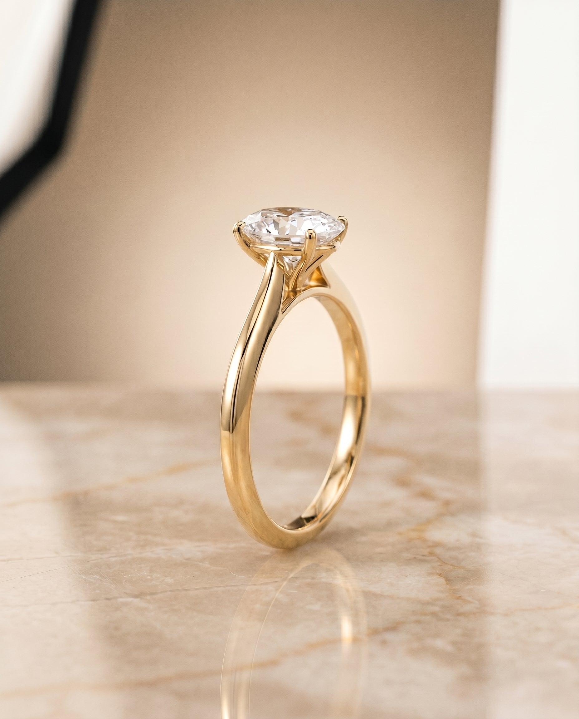 Timeless Graduated Beveled Shank Solitaire styling on The Elena oval engagement ring setting | RockHer