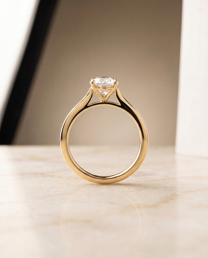 The Elena Solitaire Engagement Ring Setting for Oval Diamonds in 18K Yellow Gold