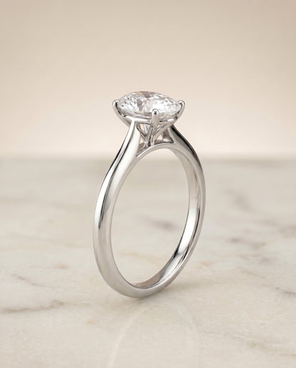 The Elena Timeless Graduated Beveled Shank Solitaire Oval Engagement Ring Setting in Platinum