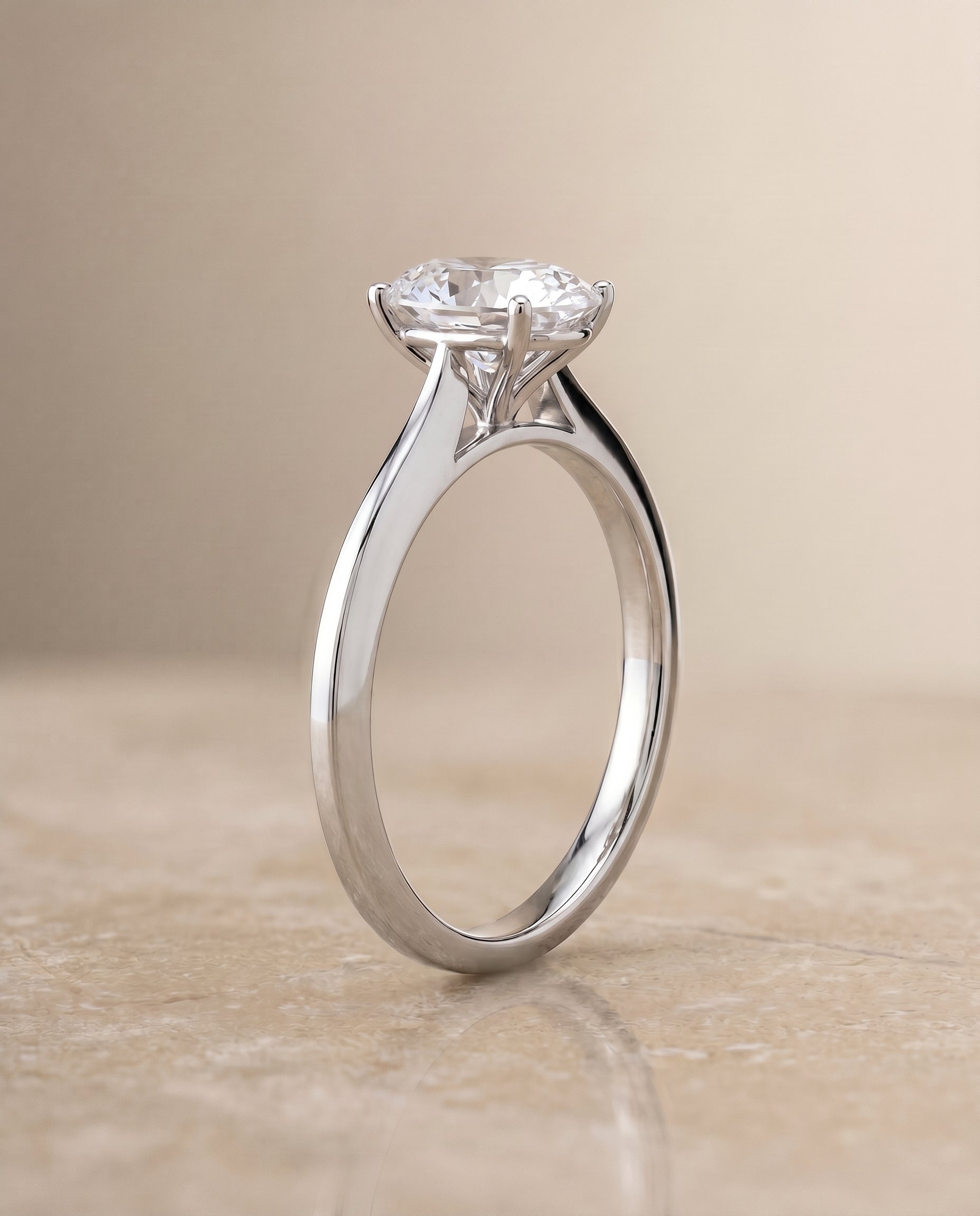 Timeless Graduated Beveled Shank Solitaire styling on The Elena oval engagement ring setting | RockHer
