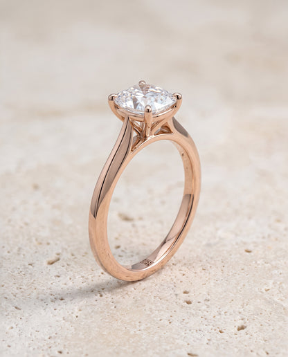 The Elena Timeless Graduated Beveled Shank Solitaire Cushion Cut Engagement Ring Setting in 14K Rose Gold