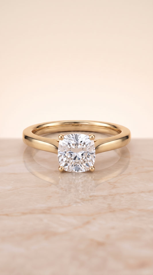 The Elena Timeless Graduated Beveled Shank Solitaire Cushion Cut Engagement Ring Setting in 18K Yellow Gold