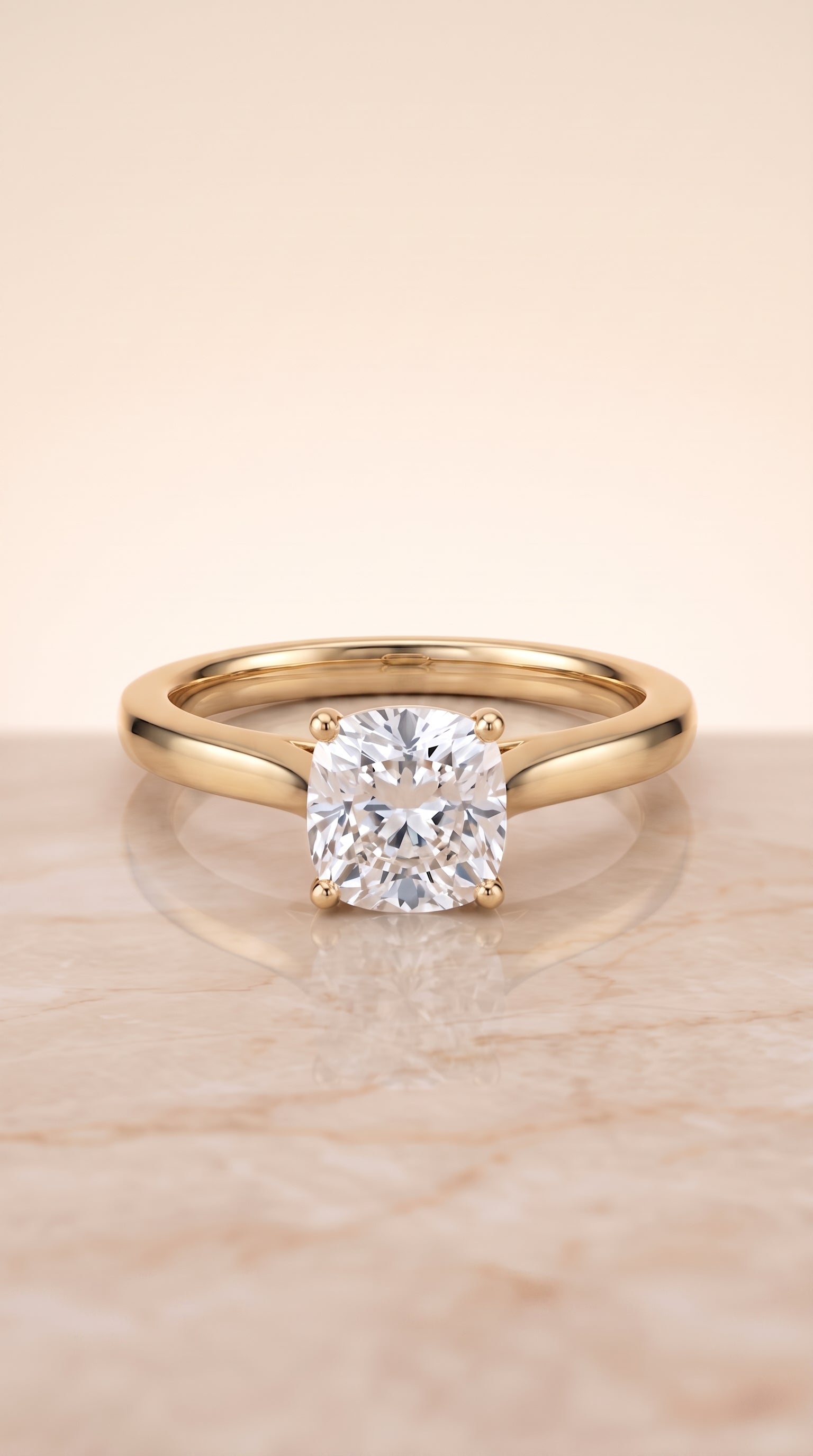 Elena Select Solitaire Cushion Cut Lab Diamond Engagement Ring in 18K Yellow Gold, shown on hand, angled | RockHer