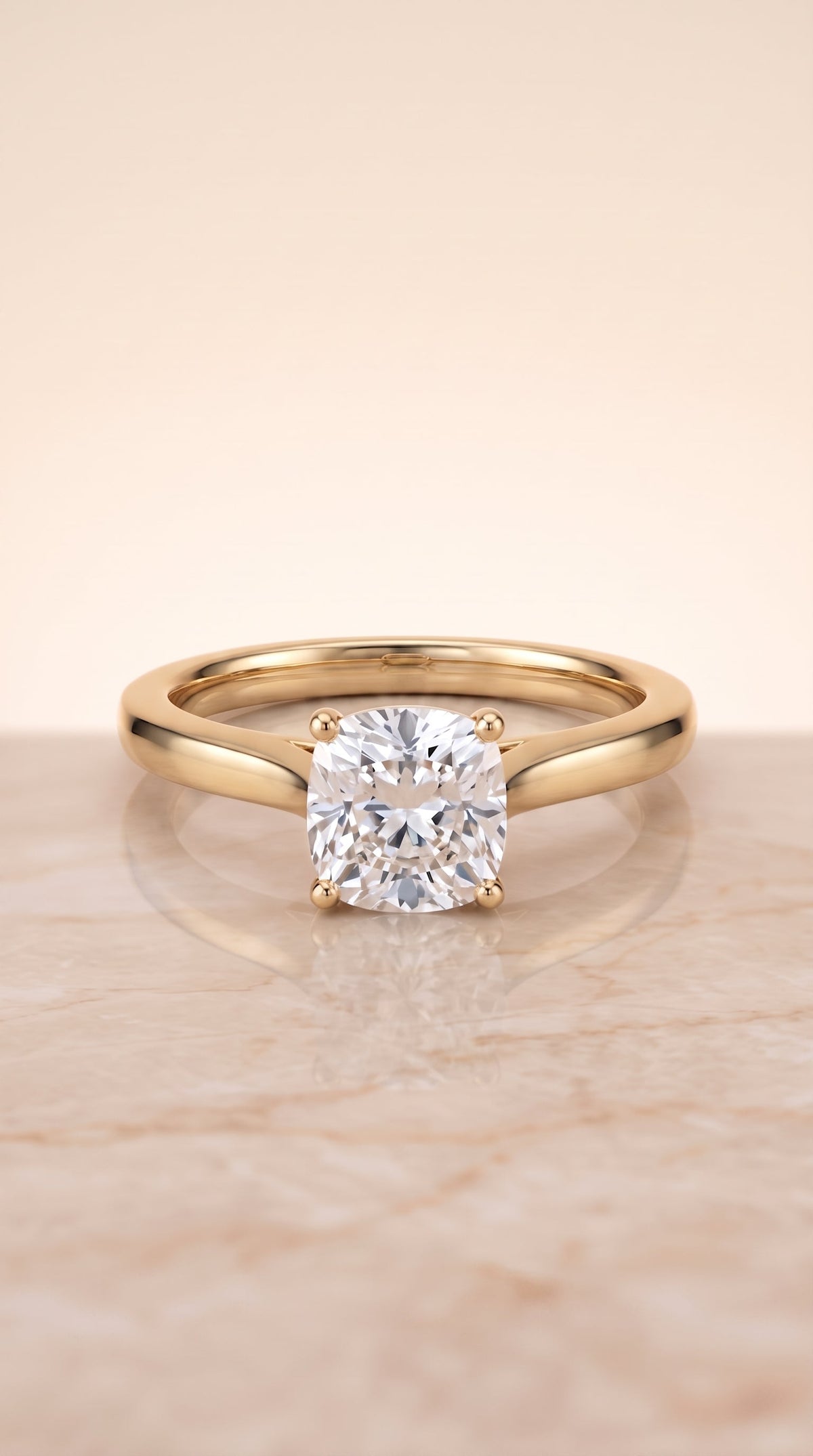 Elena Select Solitaire Cushion Cut Lab Diamond Engagement Ring in 18K Yellow Gold, shown on hand, angled | RockHer