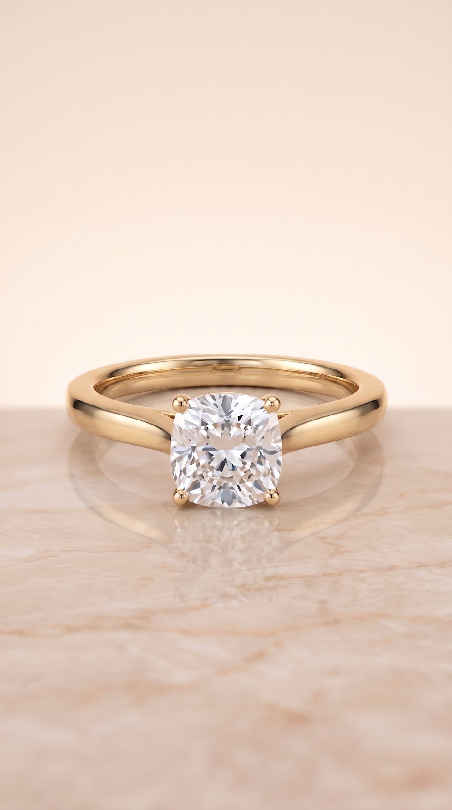 Elena Select Solitaire Cushion Cut Lab Diamond Engagement Ring in 18K Yellow Gold, shown on hand, angled | RockHer