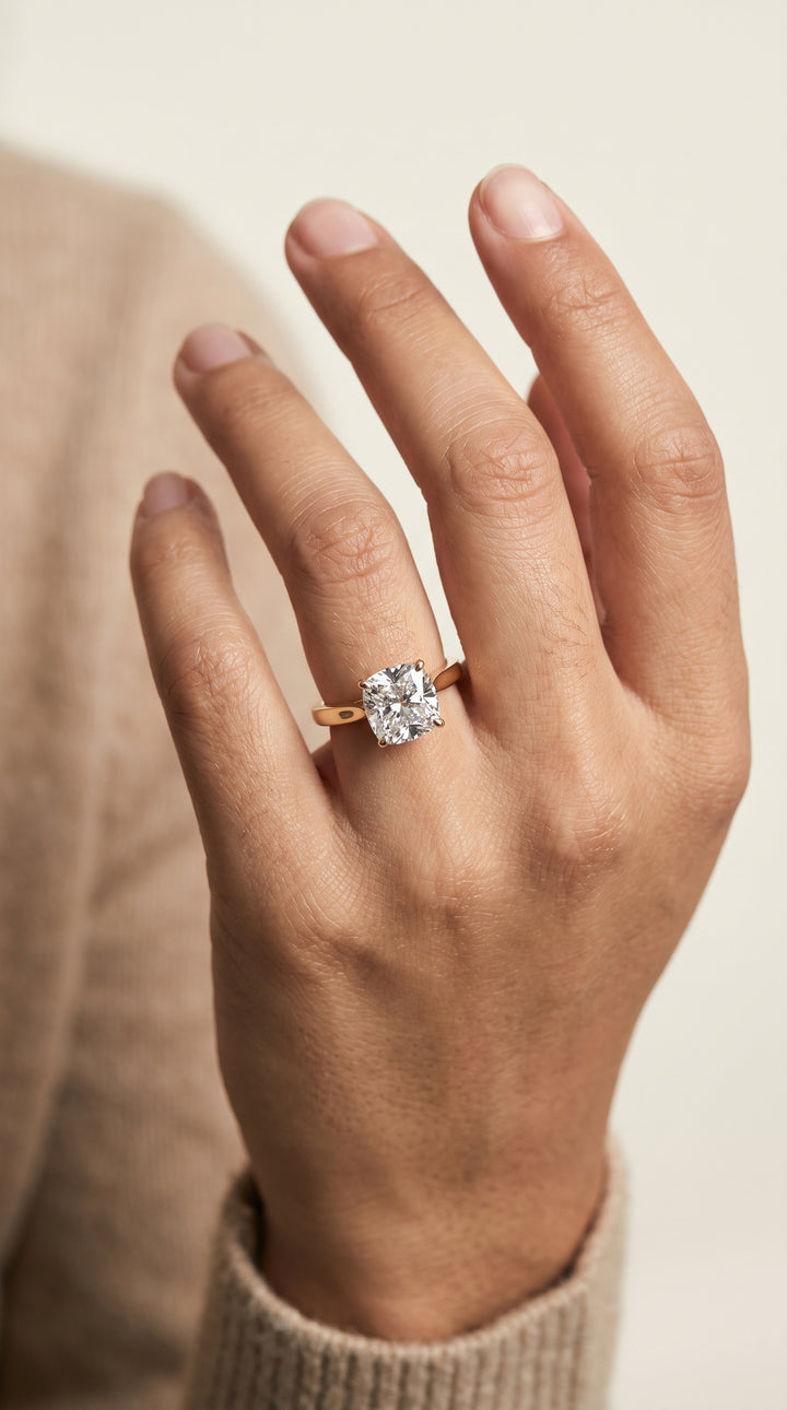 The Elena Timeless Graduated Beveled Shank Solitaire Cushion Cut Engagement Ring Setting in 18K Yellow Gold