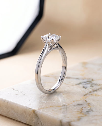 The Elena Timeless Graduated Beveled Shank Solitaire Cushion Cut Engagement Ring Setting in Platinum