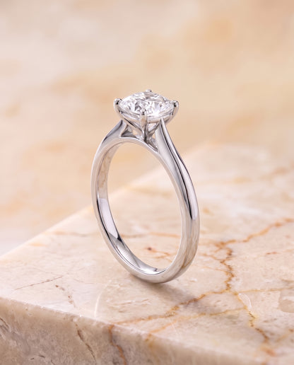 The Elena Timeless Graduated Beveled Shank Solitaire Cushion Cut Engagement Ring Setting in Platinum
