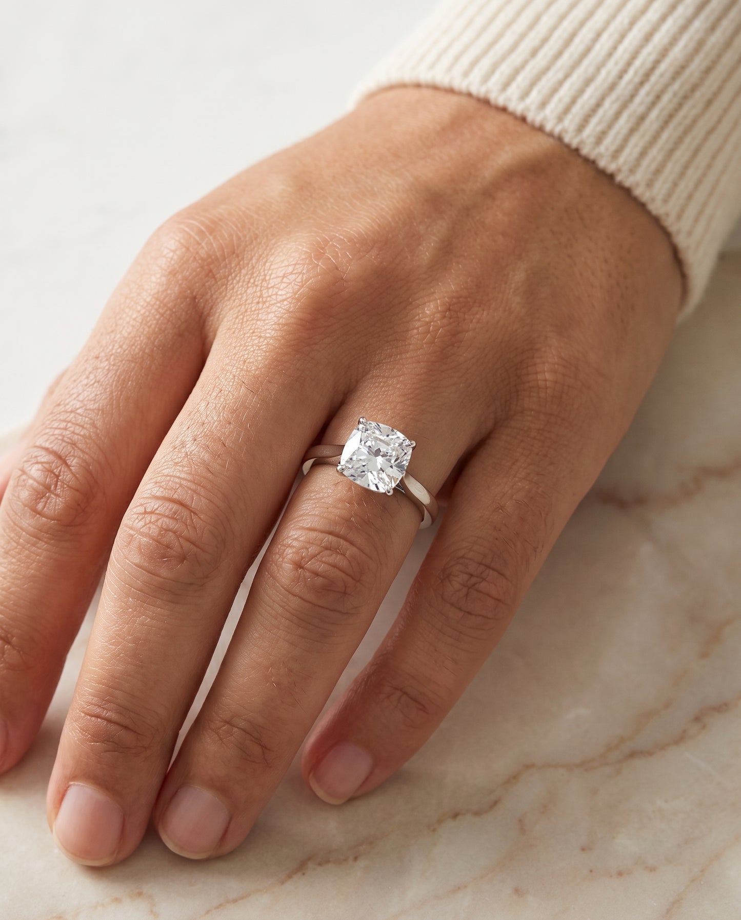 The Elena Timeless Graduated Beveled Shank Solitaire Cushion Cut Engagement Ring Setting in Platinum
