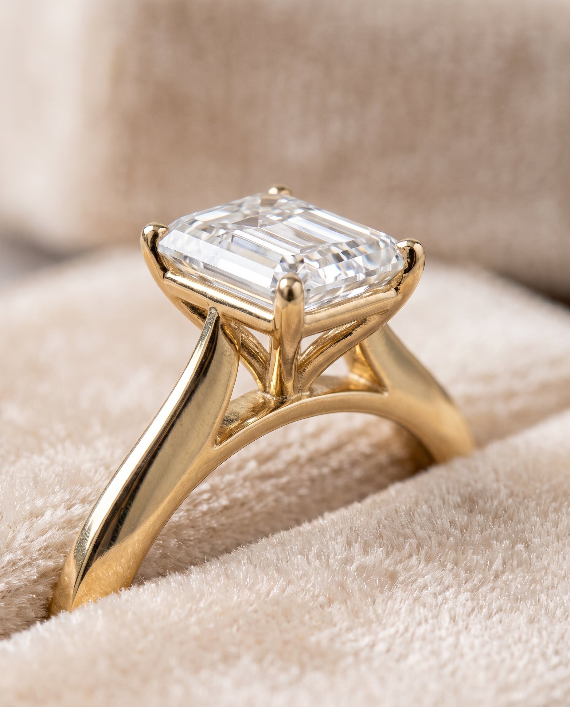 The Elena Timeless Graduated Beveled Shank Solitaire Emerald Cut Engagement Ring Setting in 18K Yellow Gold