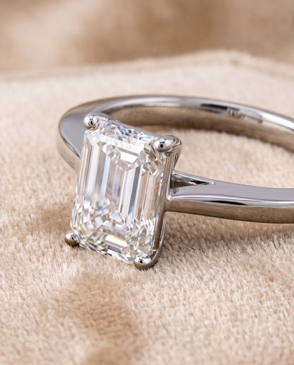 The Elena Timeless Graduated Beveled Shank Solitaire Emerald Cut Engagement Ring Setting in Platinum