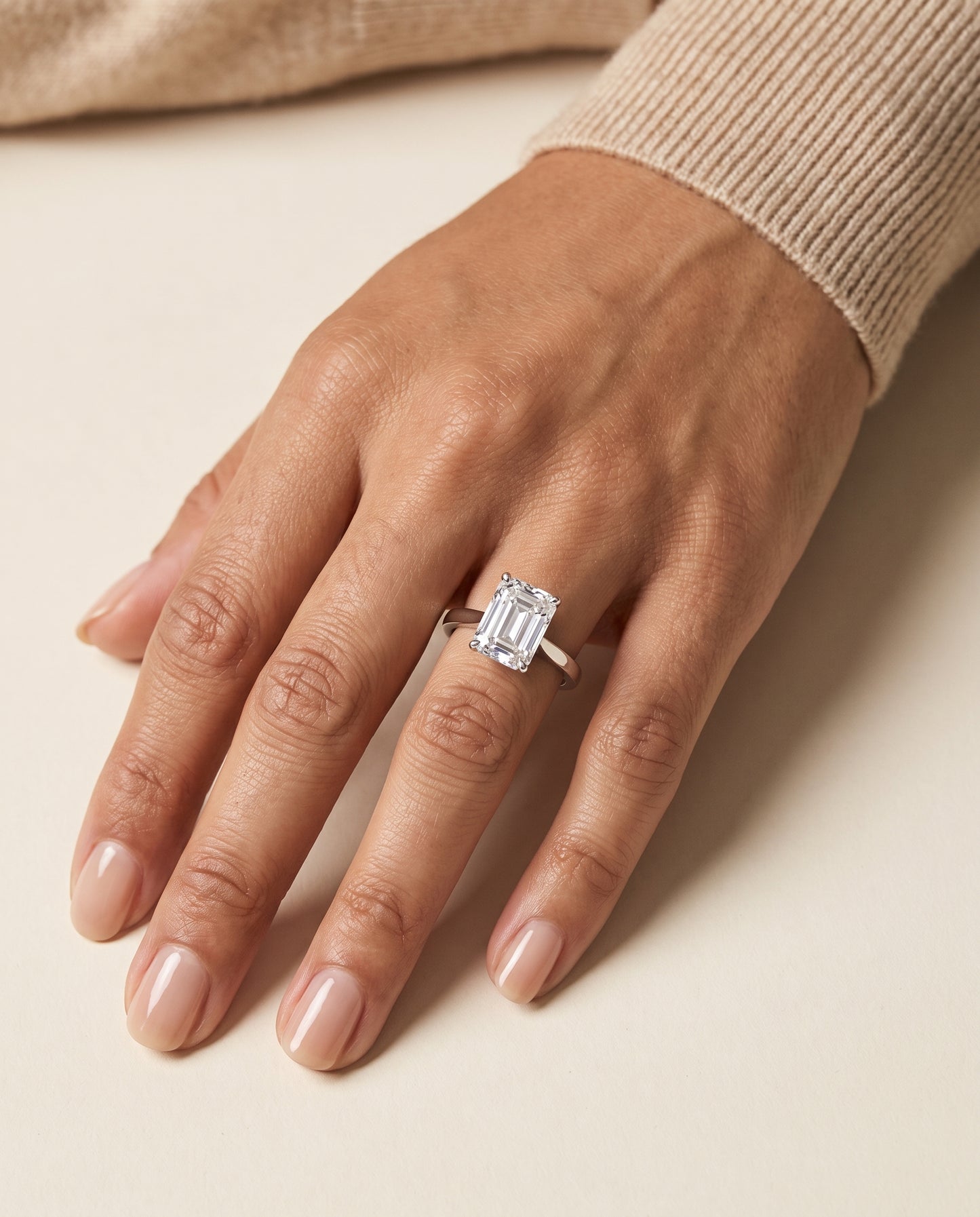The Elena Timeless Graduated Beveled Shank Solitaire Emerald Cut Engagement Ring Setting in Platinum