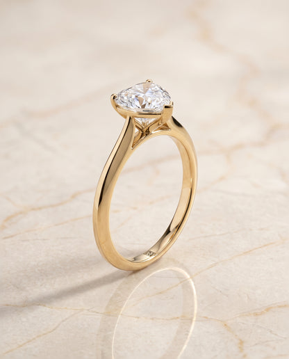 The Elena Timeless Graduated Beveled Shank Solitaire Heart Engagement Ring Setting in 18K Yellow Gold