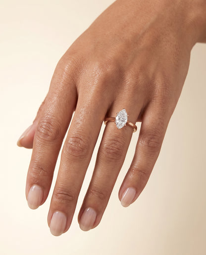 The Elena Timeless Graduated Beveled Shank Solitaire Marquise Engagement Ring Setting in 14K Rose Gold
