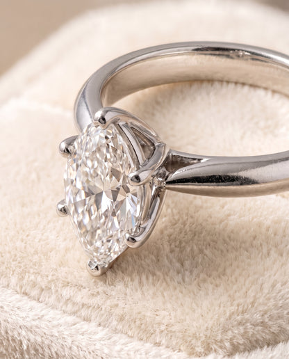 The Elena Timeless Graduated Beveled Shank Solitaire Marquise Engagement Ring Setting in 18K White Gold