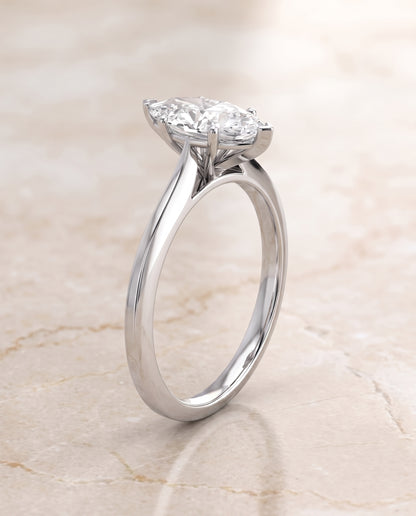 The Elena Timeless Graduated Beveled Shank Solitaire Marquise Engagement Ring Setting in 18K White Gold