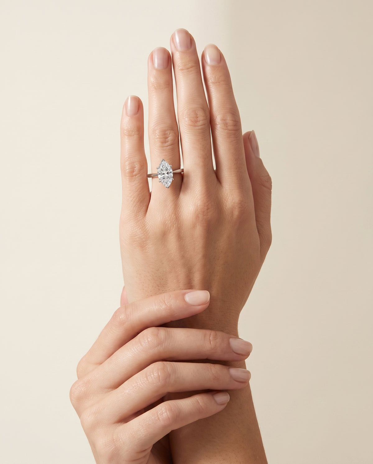 The Elena Timeless Graduated Beveled Shank Solitaire Marquise Engagement Ring Setting in 18K White Gold