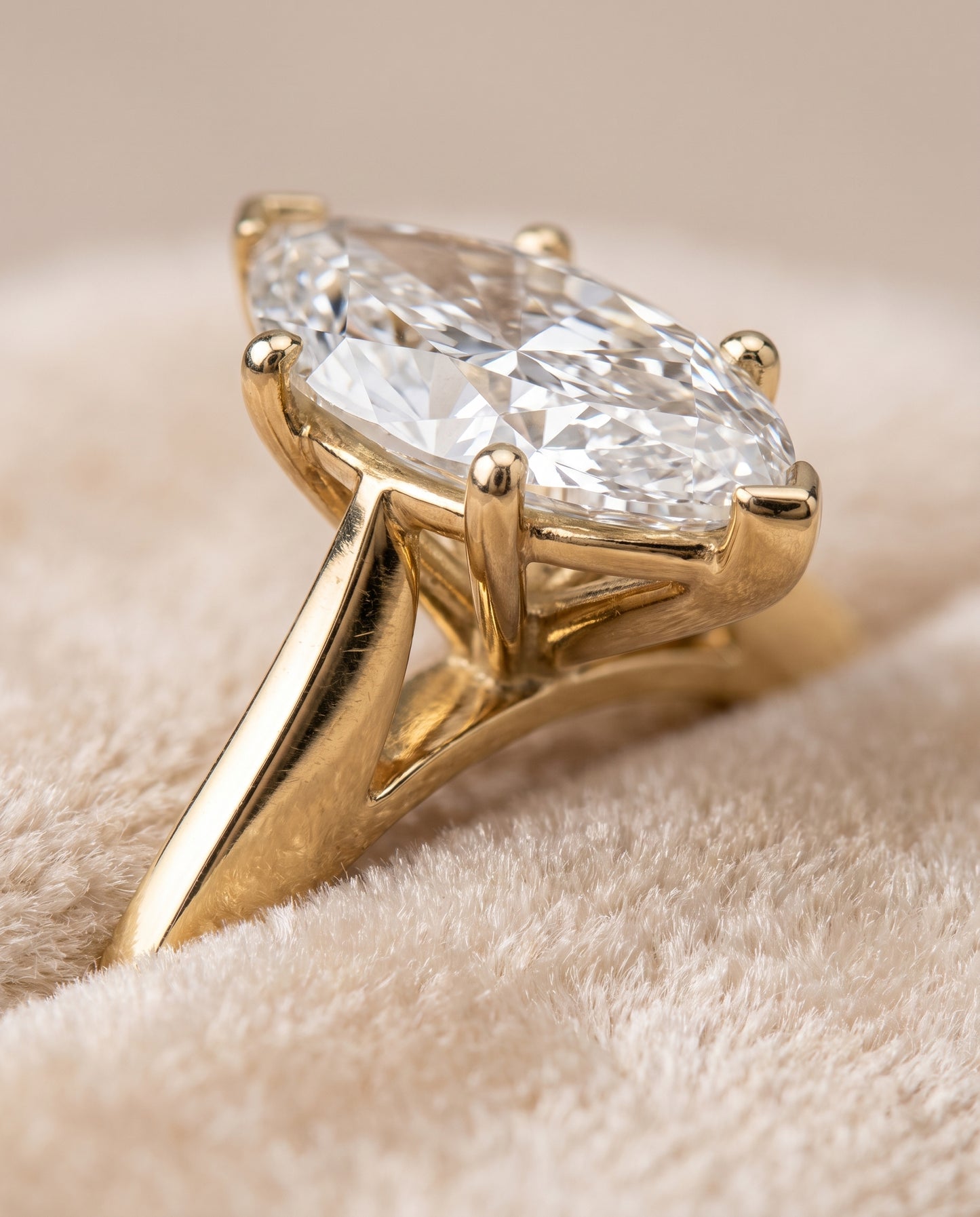 The Elena Timeless Graduated Beveled Shank Solitaire Marquise Engagement Ring Setting in 18K Yellow Gold