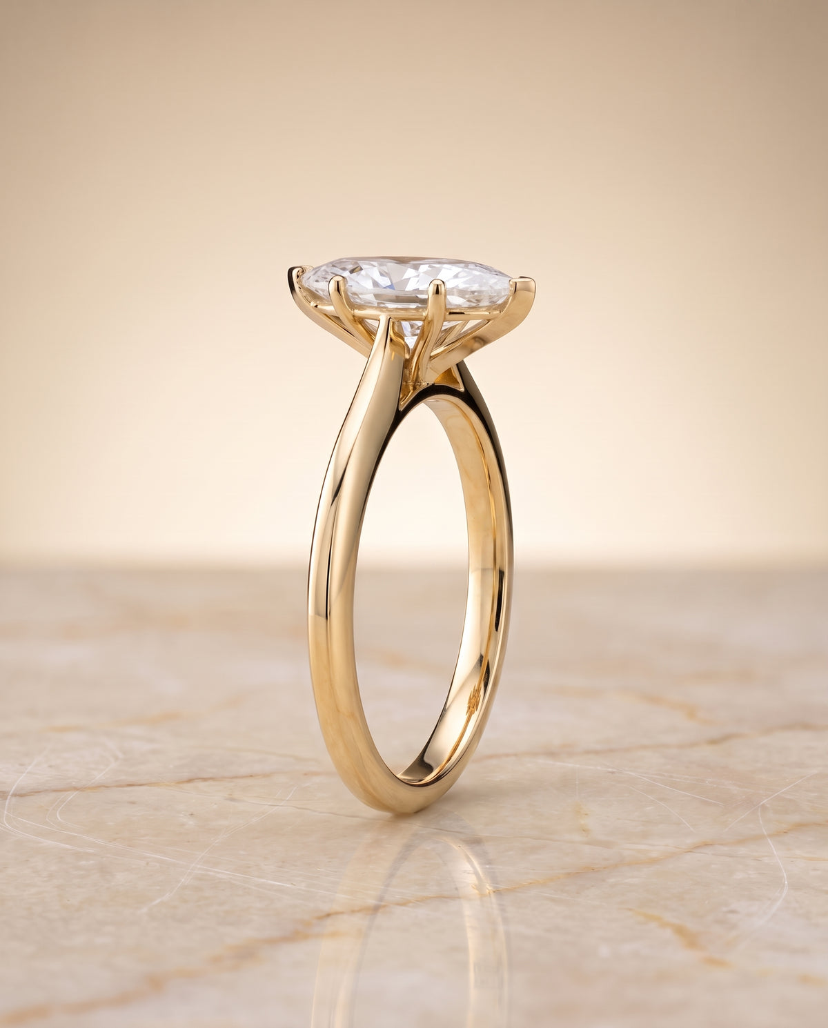 The Elena Timeless Graduated Beveled Shank Solitaire Marquise Engagement Ring Setting in 18K Yellow Gold