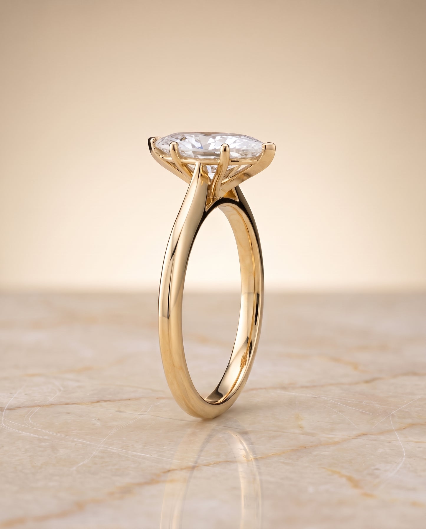 The Elena Timeless Graduated Beveled Shank Solitaire Marquise Engagement Ring Setting in 18K Yellow Gold