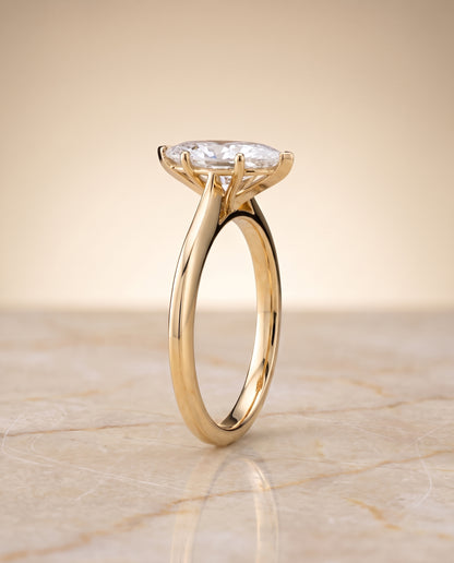 The Elena Timeless Graduated Beveled Shank Solitaire Marquise Engagement Ring Setting in 18K Yellow Gold