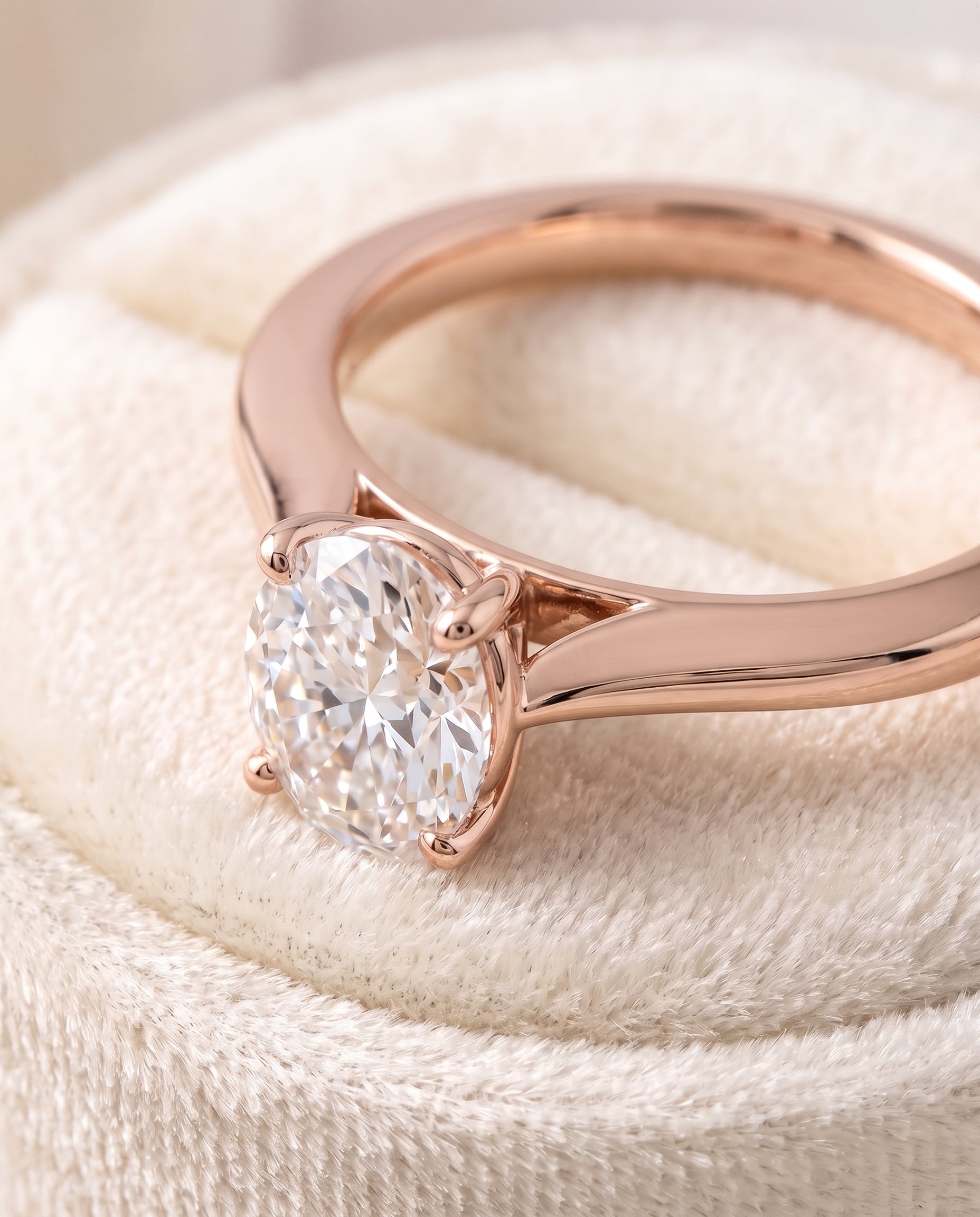 The Elena Timeless Graduated Beveled Shank Solitaire Oval Engagement Ring Setting in 14K Rose Gold