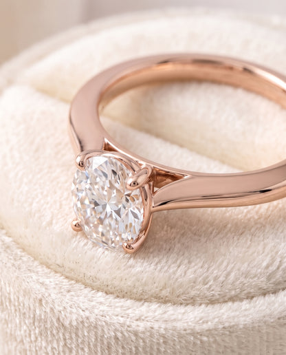 The Elena Timeless Graduated Beveled Shank Solitaire Oval Engagement Ring Setting in 14K Rose Gold