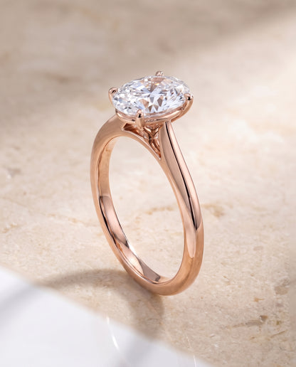 The Elena Timeless Graduated Beveled Shank Solitaire Oval Engagement Ring Setting in 14K Rose Gold