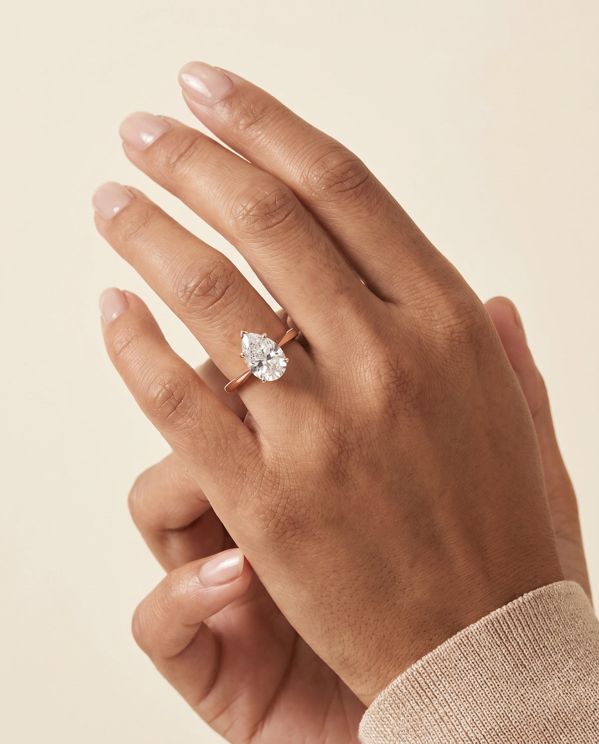 The Elena Timeless Graduated Beveled Shank Solitaire Pear Engagement Ring Setting in 14K Rose Gold