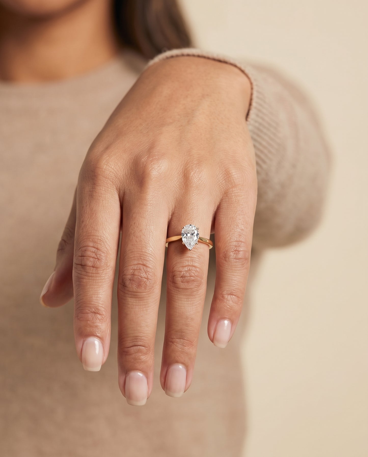 The Elena Timeless Graduated Beveled Shank Solitaire Pear Engagement Ring Setting in 18K Yellow Gold