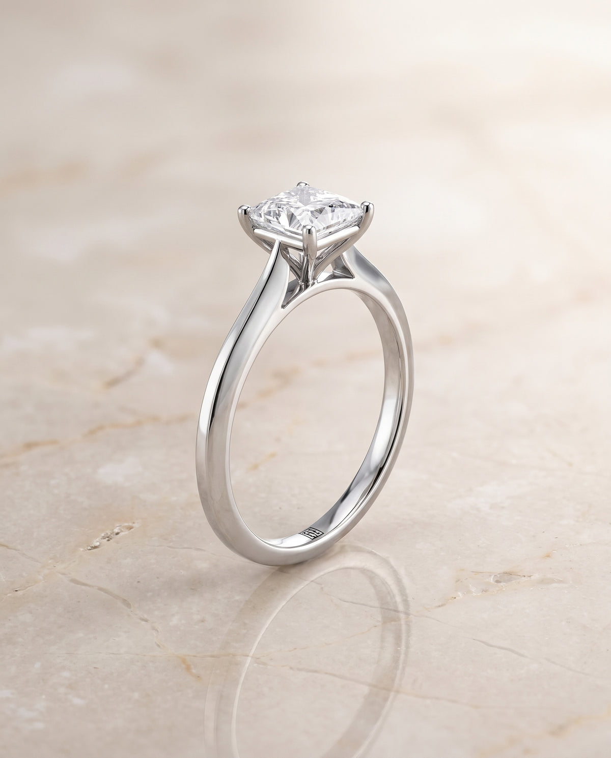 The Elena Timeless Graduated Beveled Shank Solitaire Princess Cut Engagement Ring Setting in Platinum