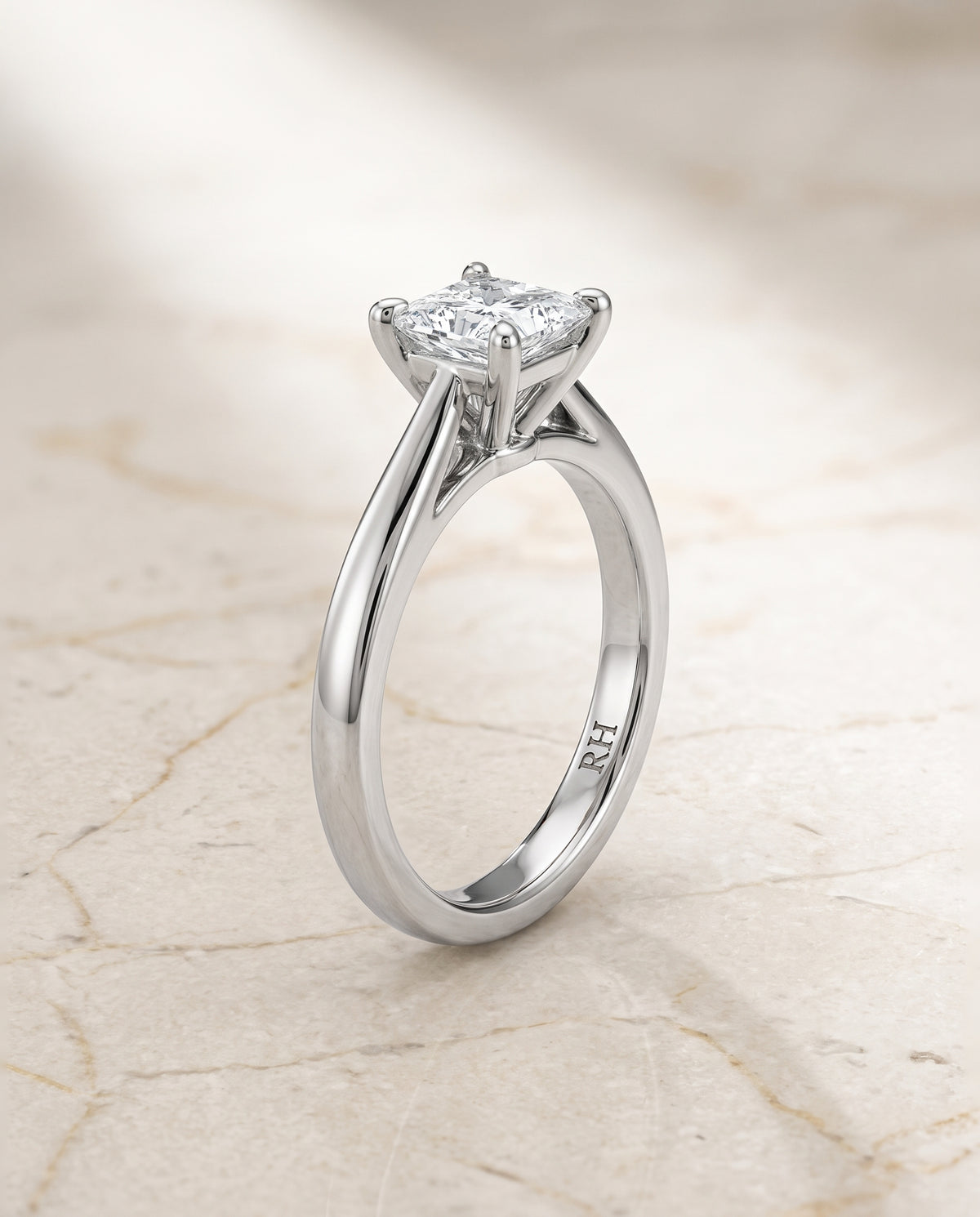 The Elena Timeless Graduated Beveled Shank Solitaire Princess Cut Engagement Ring Setting in Platinum