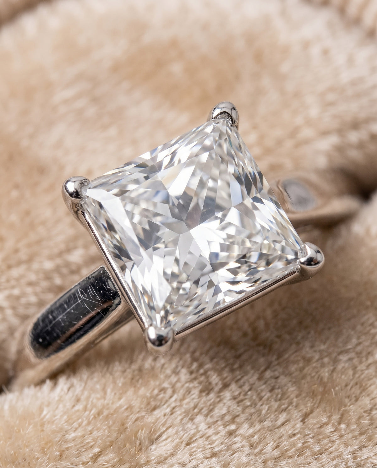 The Elena Timeless Graduated Beveled Shank Solitaire Princess Cut Engagement Ring Setting in Platinum