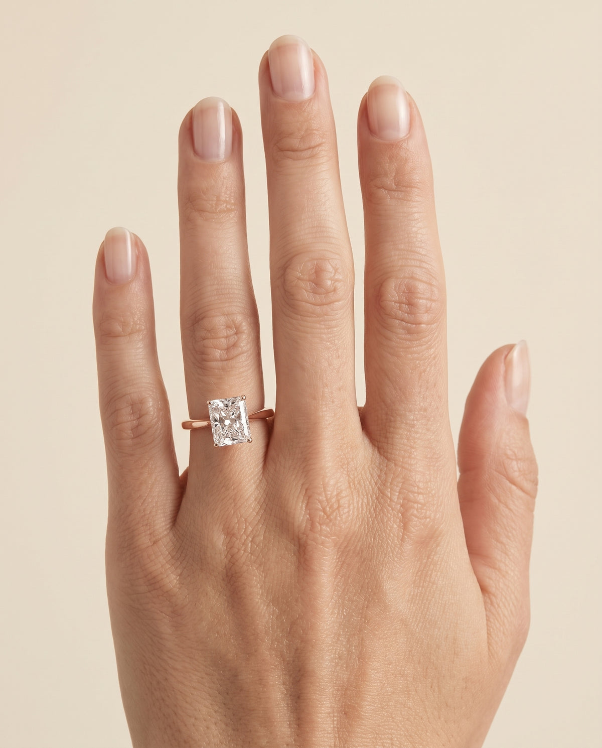 The Elena Timeless Graduated Beveled Shank Solitaire Radiant Cut Engagement Ring Setting in 14K Rose Gold