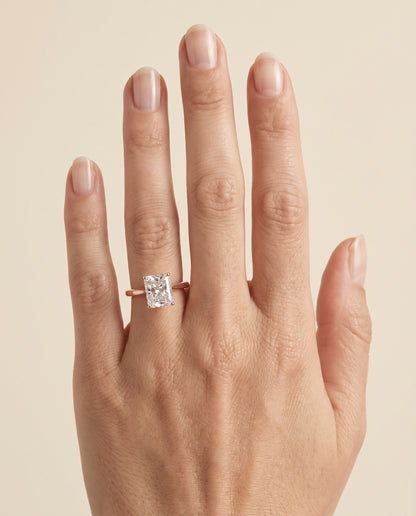 The Elena Timeless Graduated Beveled Shank Solitaire Radiant Cut Engagement Ring Setting in 14K Rose Gold