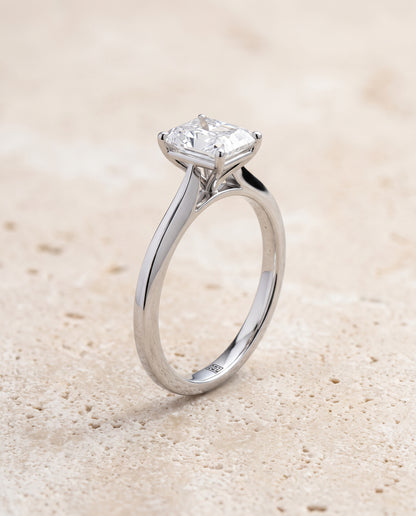The Elena Timeless Graduated Beveled Shank Solitaire Radiant Cut Engagement Ring Setting in Platinum
